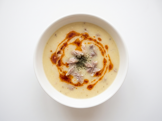 Düğün Çorbası — Wedding soup with lamb neck, yogurt and lemon, finished with pepper butter.
